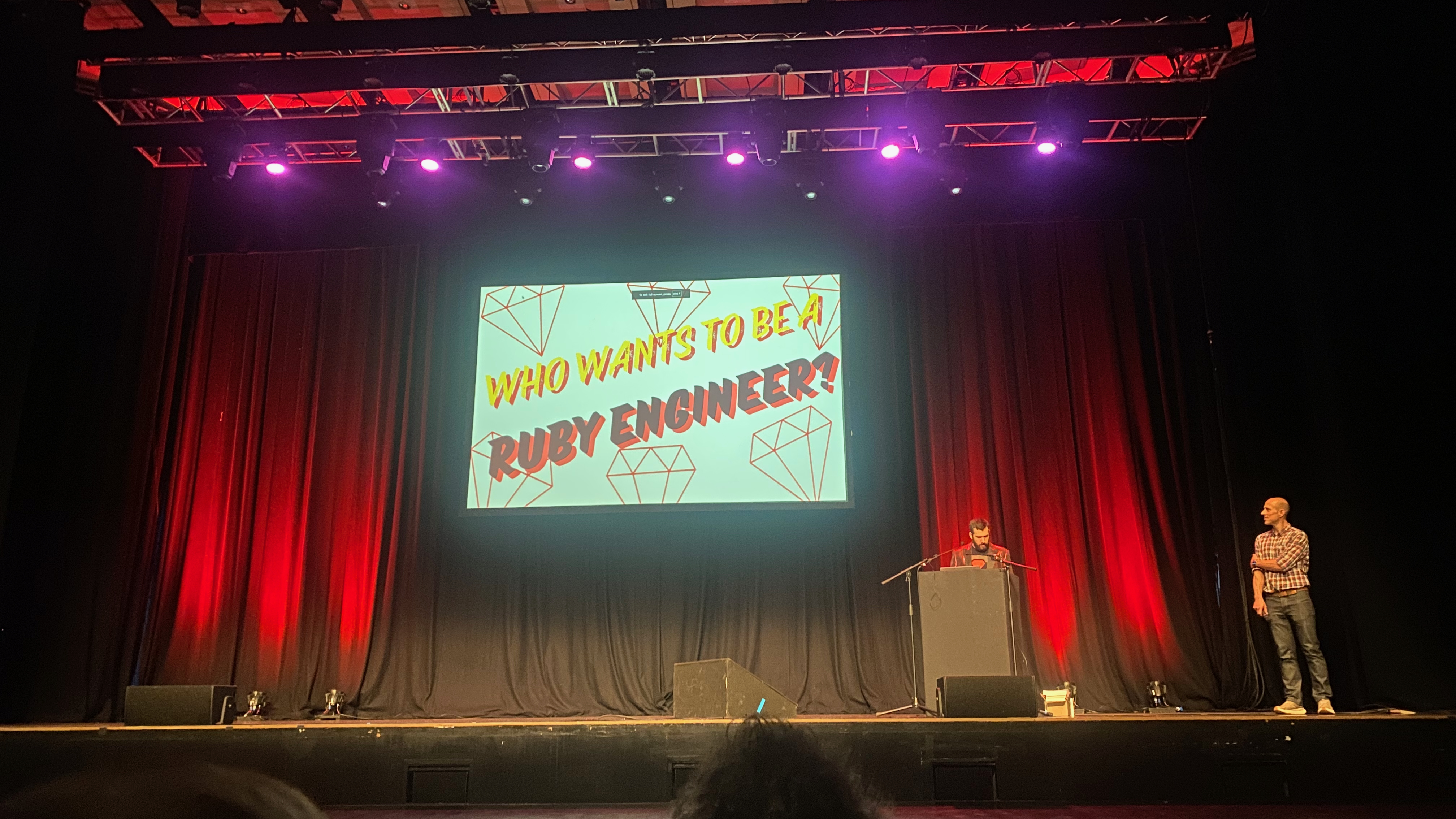 Drew Bragg presenting his game show "Who Wants to be a Ruby Engineer?" at
Brighton Ruby 2024